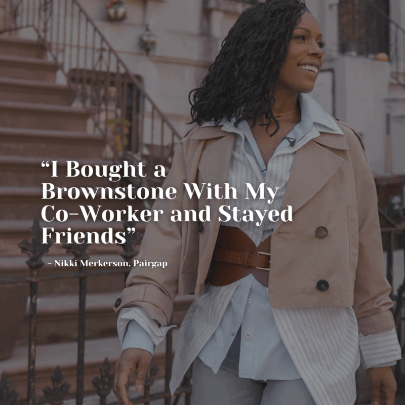 Nikki Merkerson smiling in front of a Brooklyn brownstone, dressed in a belted coat and layered shirt