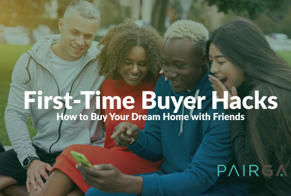 A group of four diverse friends smiling and looking at a smartphone together, representing the joy and collaboration of co-buying a home.
