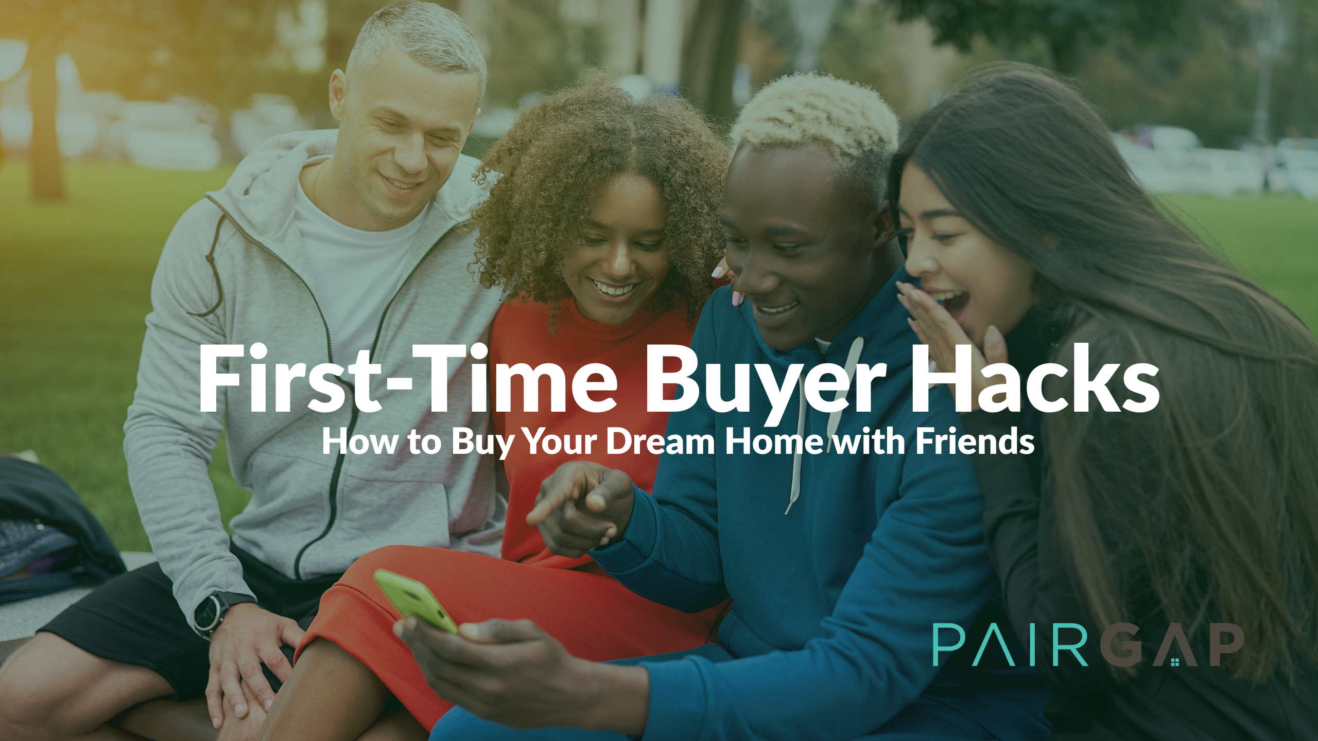 A group of four diverse friends smiling and looking at a smartphone together, representing the joy and collaboration of co-buying a home.
