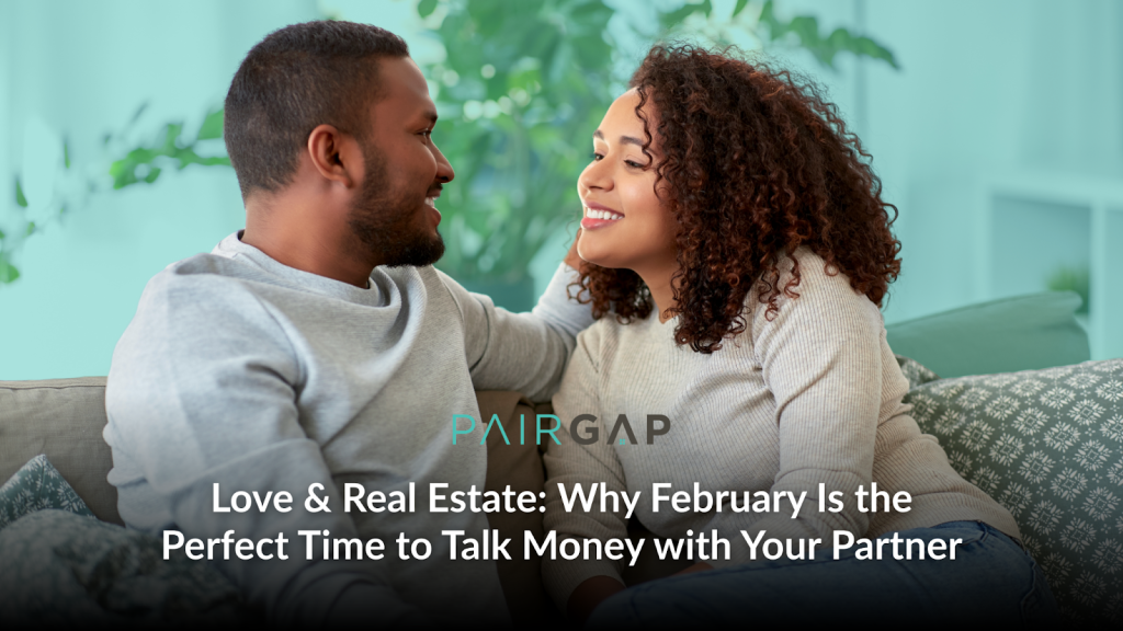 Couple sitting together on a couch smiling at each other while discussing their future home and finances