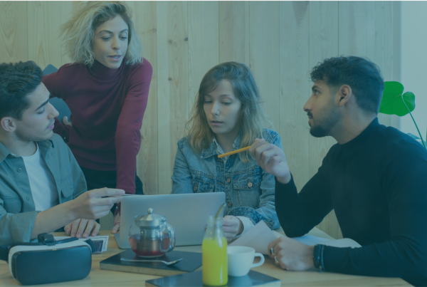 Four prospective co-buyers reviewing the finances and ownership plan for buying a house together