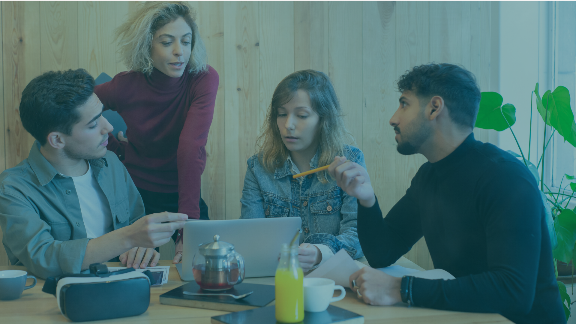Four prospective co-buyers reviewing the finances and ownership plan for buying a house together