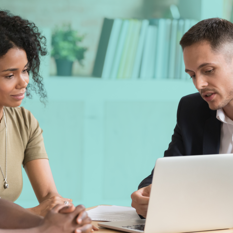Two prospective co-buyers meeting with a real estate professional to discuss finances, compatibility, and plans for buying a home together.